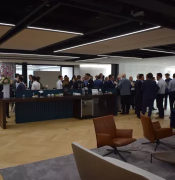 Old Members gathering and talking to each other with drinks