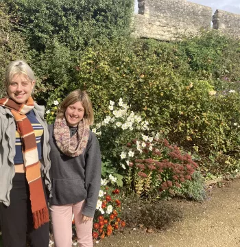 Danni and Maddy in front of the herbaceous border and City Wall