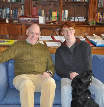 The Warden and Patrick Mayhew sitting on a sofa in the Warden's office