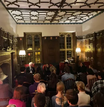 The three speakers sat in front of a packed audience