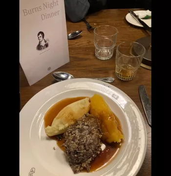 Haggis, neeps and tatties with menu featuring Robert Burns