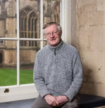 Professor Timothy Williamson sat by a window