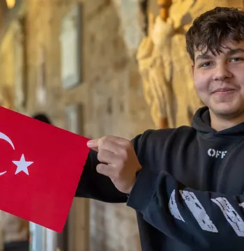 Student poses with a Turkish flag
