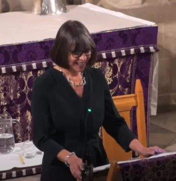 Rebecca Lawrence speaking at a lectern