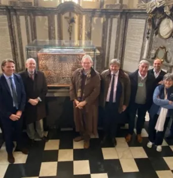 People stood in a Church by the side of the Courtrai Chest