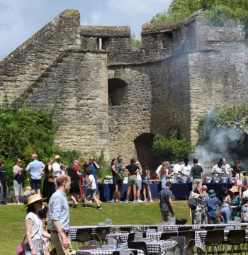 Lots of people queuing for a barbeque