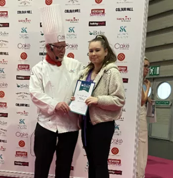 Elycia receiving her cerificate