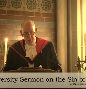 The Warden giving his sermon in Keble Chapel surrounded by candles. There is a text at the bottom of the image which says "The University Sermon on the Sin of Pride".