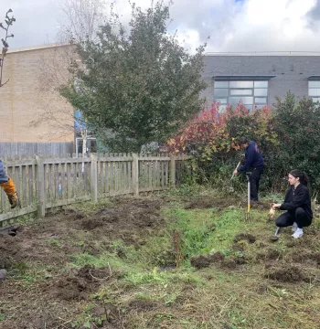 JCR volunteers clear space for Wood Farm Primary School's pond