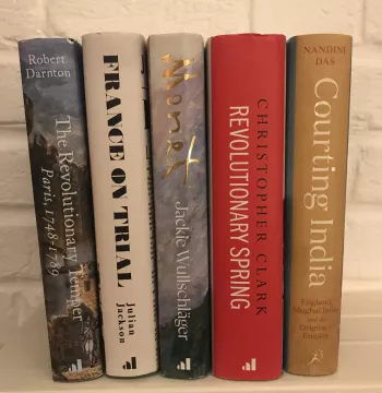 The five shortlisted books on a shelf