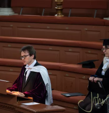 Joe Conlon addresses the Sheldonian Theatre