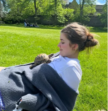 Arden Eveleigh-Evans with Tessa, the college tortoise
