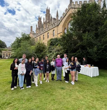 Students from ISF School in Hong Kong pose for a picture with the Warden in his garden