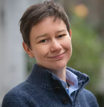 Colour photo of Katy Hamilton smiling at the camera