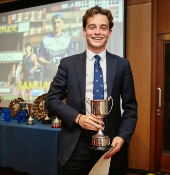 Samuel Thompson holding trophy
